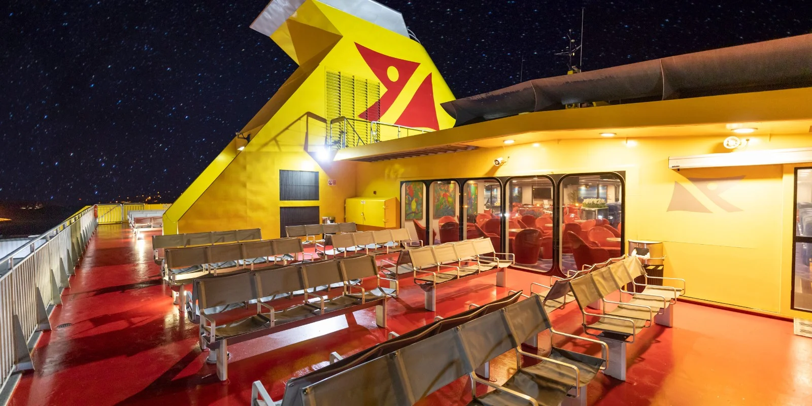 Outdoor terrace of the Benchijigua Express fast ferry at night